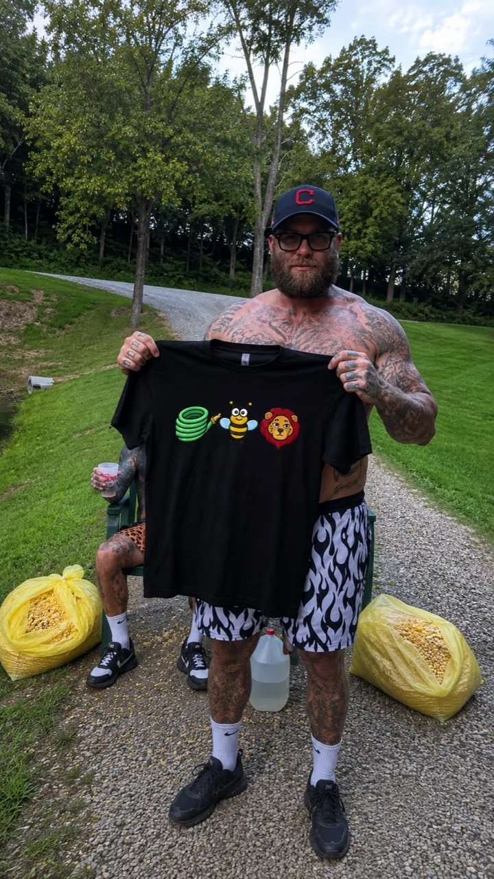 Black Hose Bee Lion shirt held up outdoors